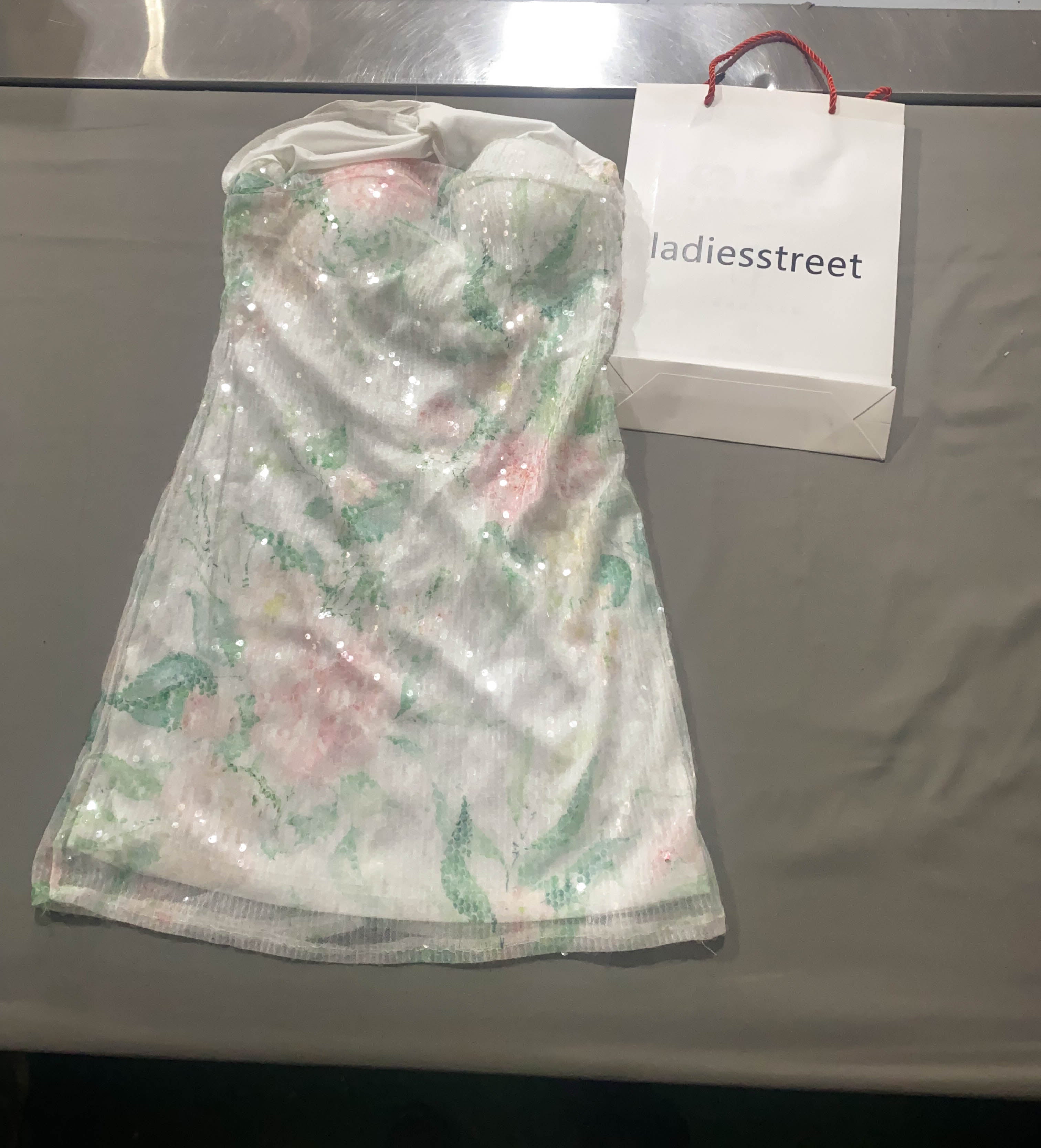 ladiesstreet Magnolia Floral Sequin Bow Back Mini Dress Floral pattern, sequin-embellished, stretchy knit lining Evening coats