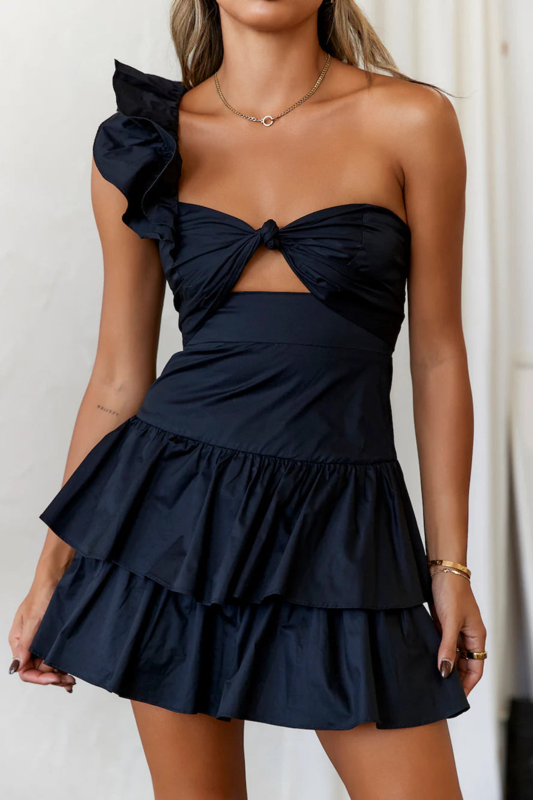 Black ruffled dress, a sweet yet edgy little black dress that flatters the figure