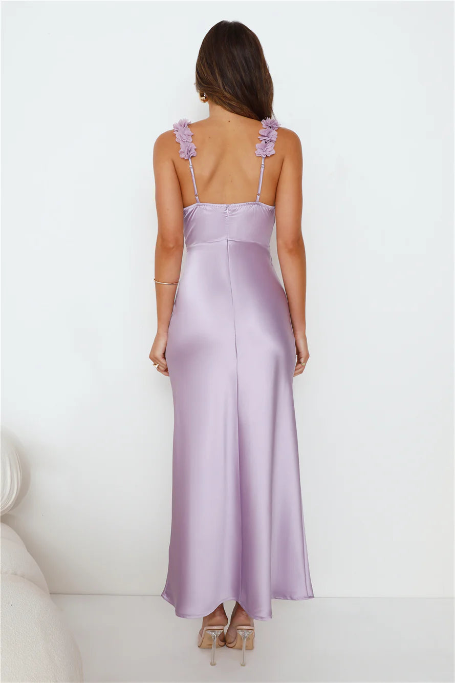 Parties In Spring: A soft pink satin maxi dress – a show-stopping outfit for parties.